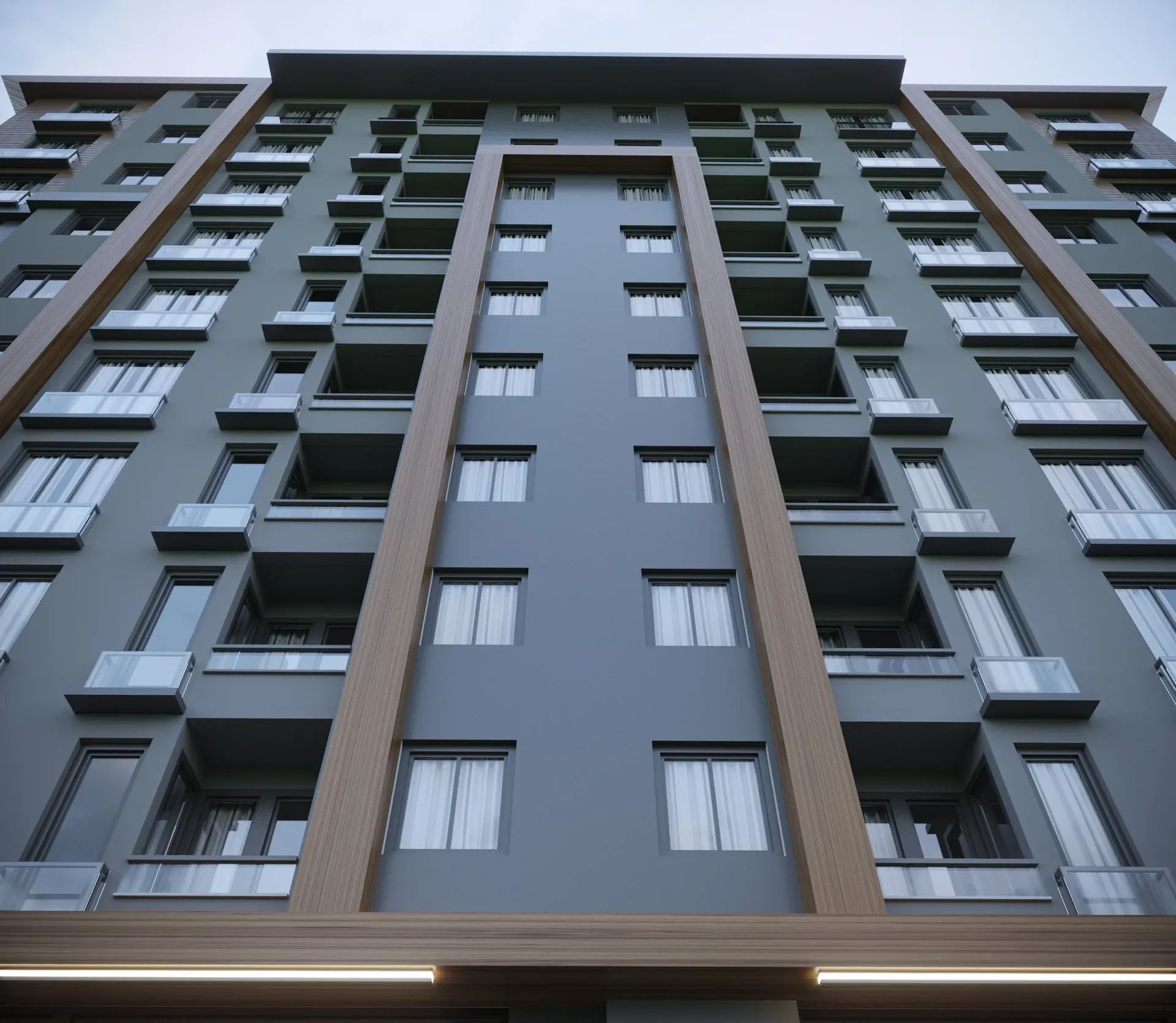 Çamlık İnşaat apartman projesi - ahşap dokulu düşey cephe detayı ve balkonların alttan görünümü